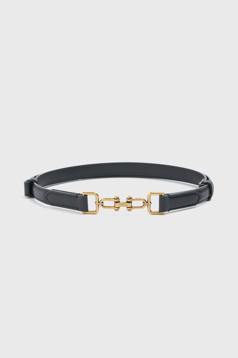 Узкий ремень с фигурной пряжкой